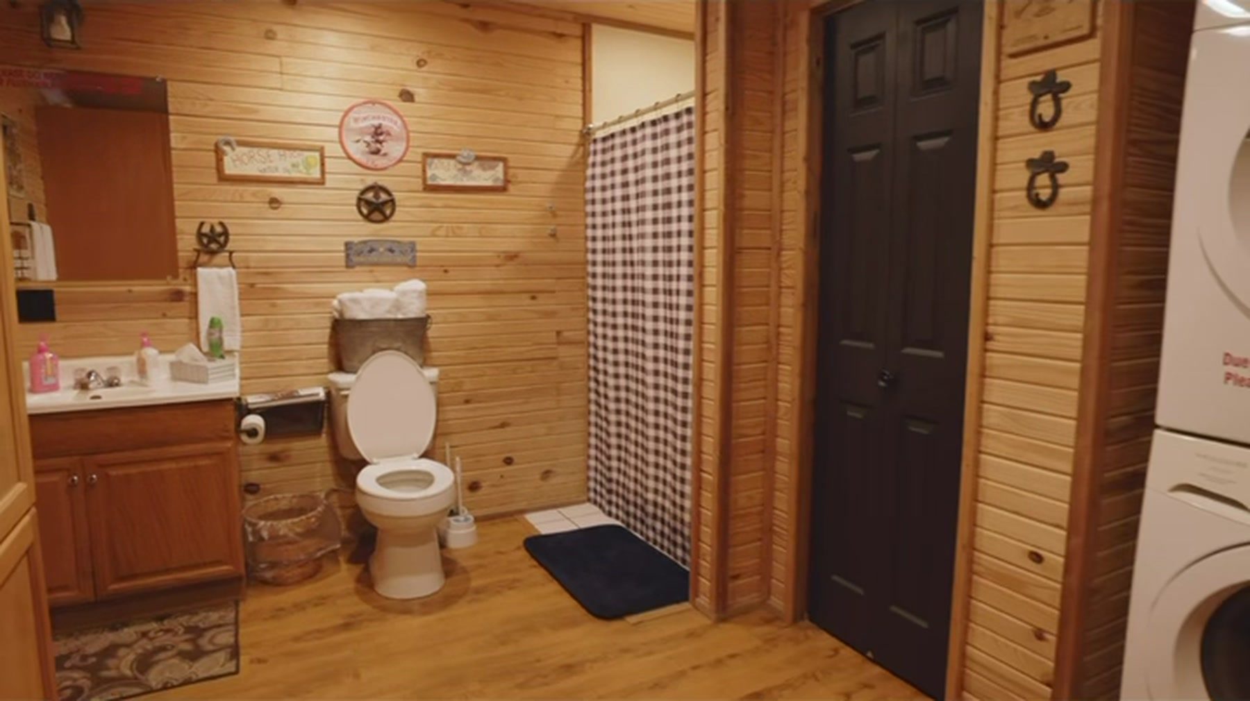 Bathroom with the in-unit washer and dryer alongside