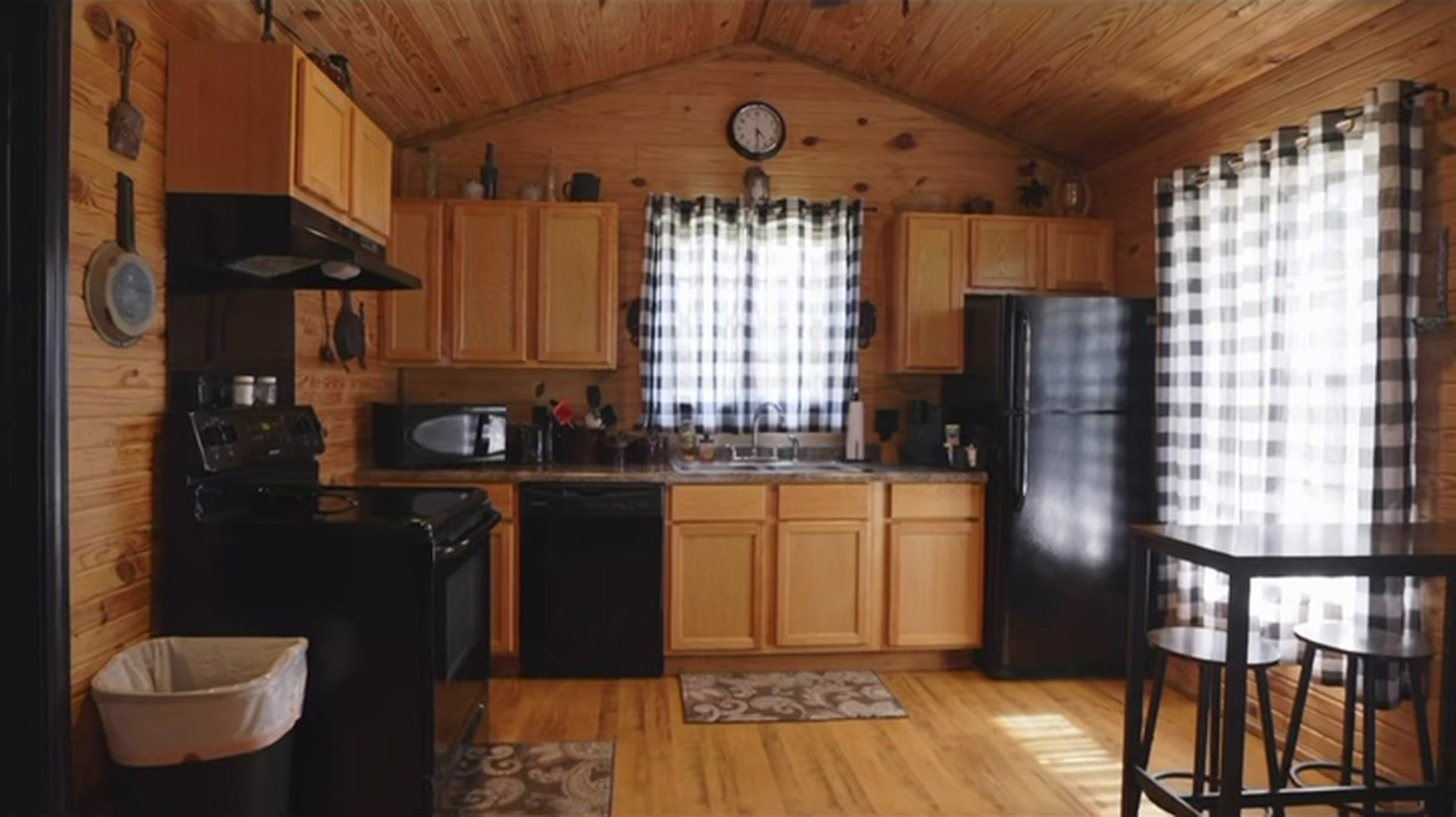 Full kitchen and bar seating inside one of the furnished guest lodging